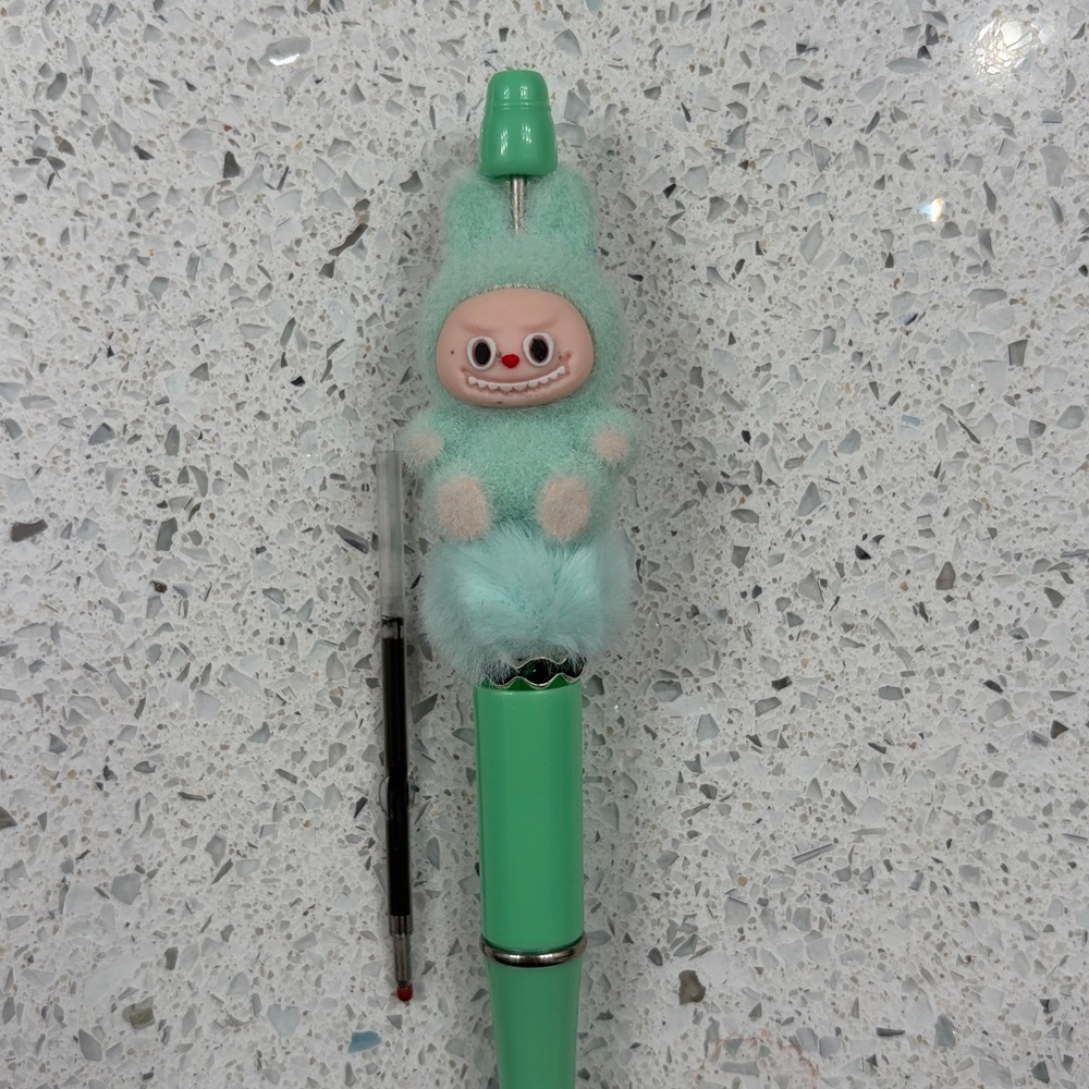 Green Labubu pen with ink refill